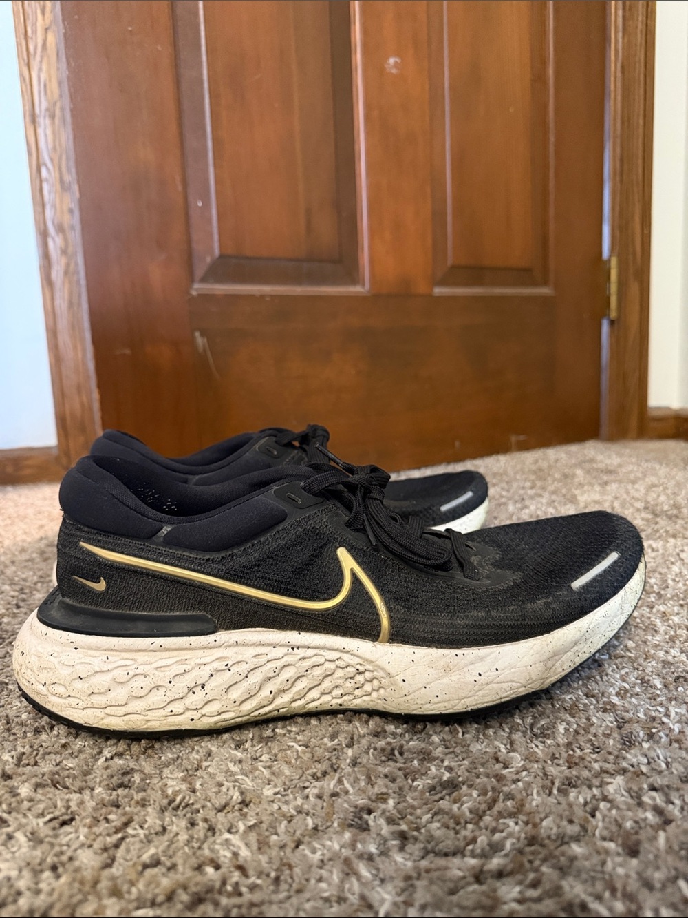 Nike Black with Gold Swoosh Running Shoes